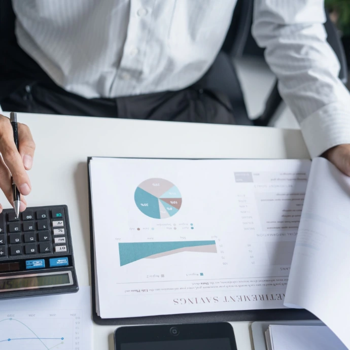 Construction professionals planning budgets and reviewing project costs while maintaining high-quality materials and execution standards for efficient and cost-effective project delivery.